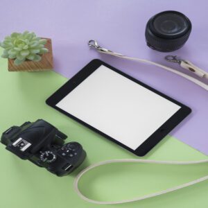 top-view-digital-tablet-with-blank-screen-camera-camera-lens-belt-succulent-plant-dual-background (1)